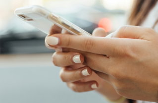 woman-holding-i-phone-during-daytime.jpg woman holding iPhone during daytime