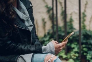 woman-using-gold-smartphone.jpg woman using gold smartphone